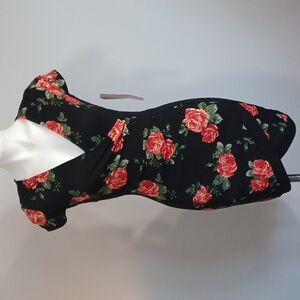 Form fitting v-neck black dress with rose floral print. Faux wrap.  Small.  NWT